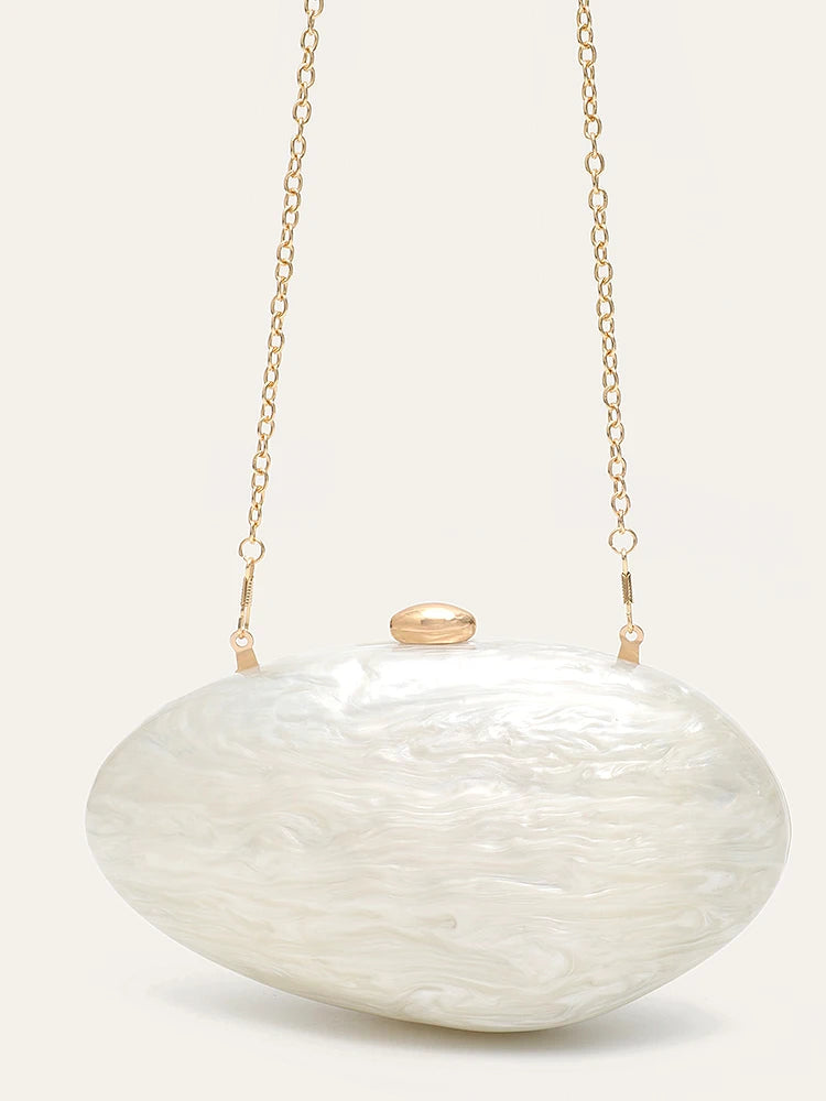 Bolsa Clutch Madrepérola – A Joia da Sua Produção